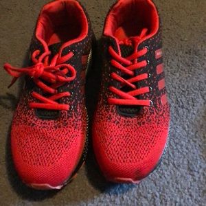 “Keep running” red and black sneakers.